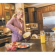 woman-cooking-kitchen-claytonhomes-therevew=credit-posted-manufacturedhomelivingnews-com-