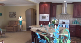 living-room-kitchen-umh-homes-model-MH-village-manufactured-home-living-news-2