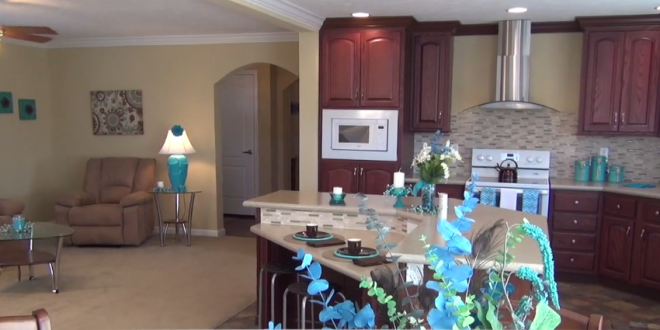 living-room-kitchen-umh-homes-model-MH-village-manufactured-home-living-news-2